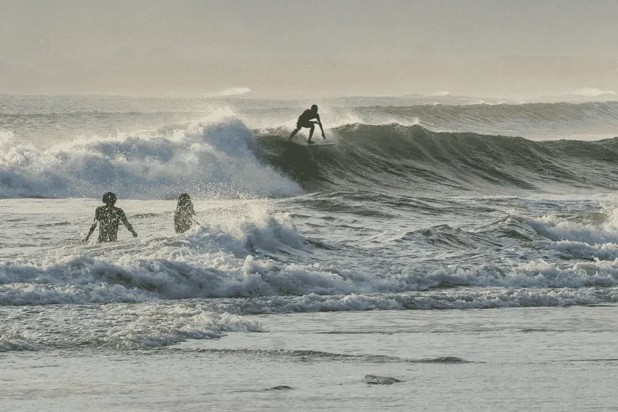 Surfers at Arugam Bay main point, Sri Lanka