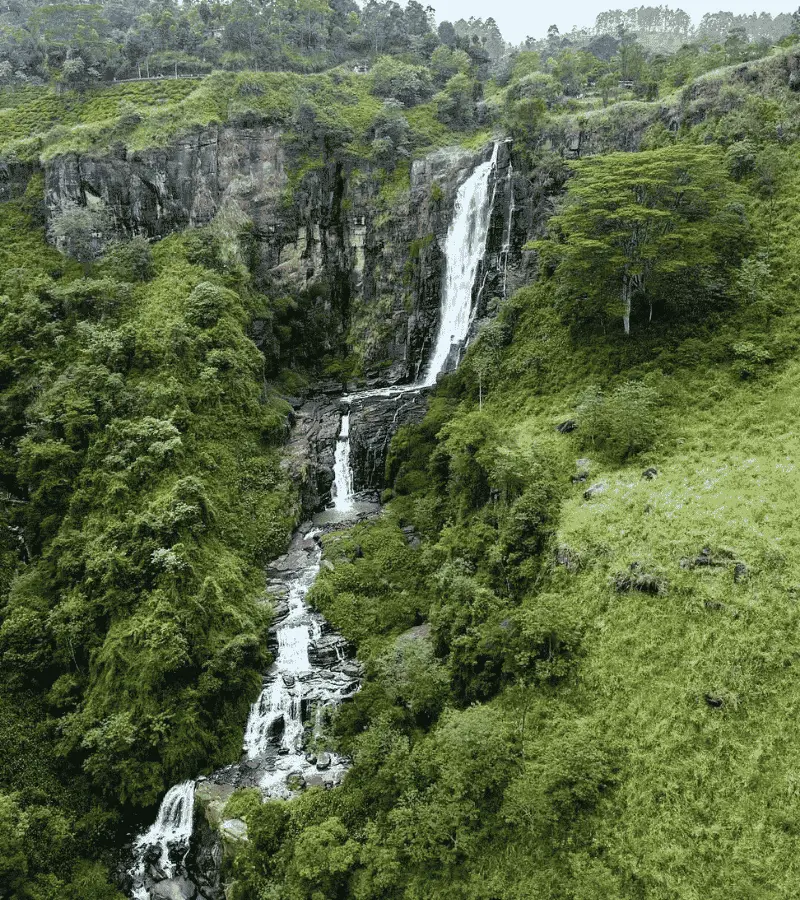Devon Falls Sri Lanka — the Veil of the Valley waterfall surrounded by mist and tea plantations near Nuwara Eliya