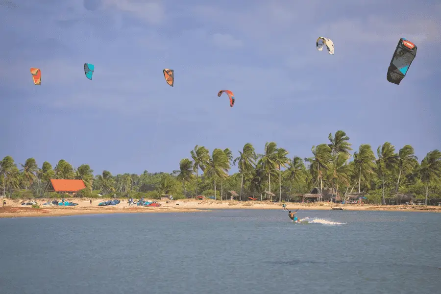 Kalpitiya kite surfing lagoon Sri Lanka — colorful kites over flat lagoon water on the northwestern coast