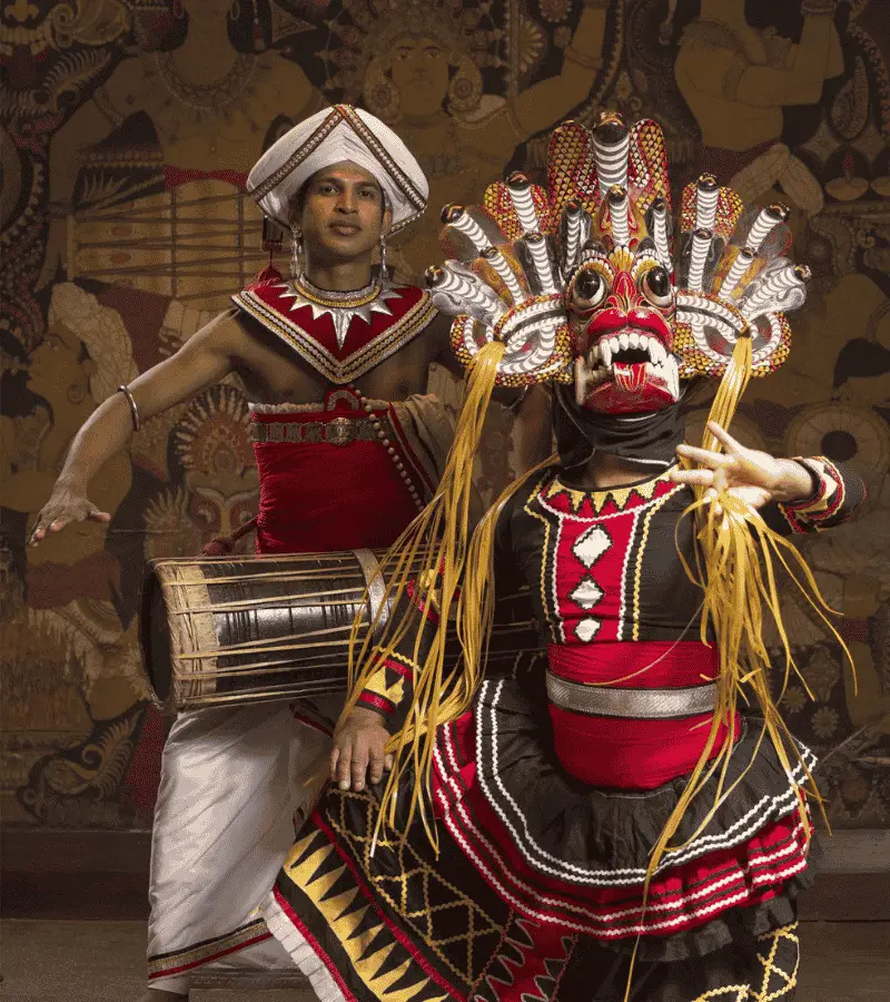 Traditional Kandyan dance performance with drummers and costumed dancers in Sri Lanka