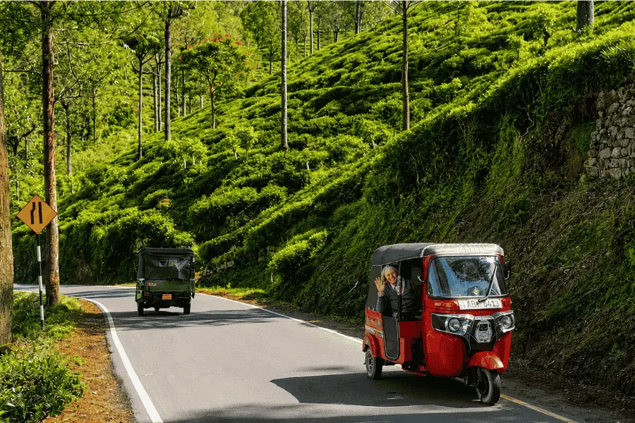 Tuk tuk driving through hill country roads from Kandy toward Nuwara Eliya