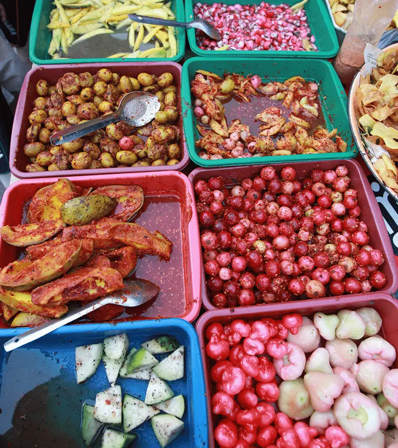 Sri Lankan achcharu — spicy street-style pickle mix made with mango, pineapple, and chili