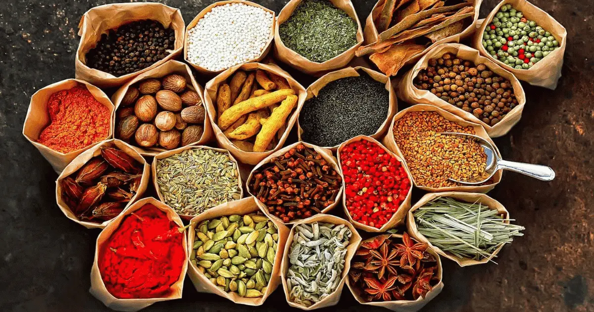 Sri Lankan spices — cinnamon, cardamom, cloves, black pepper, and curry leaves from one of Asia's oldest spice trading islands