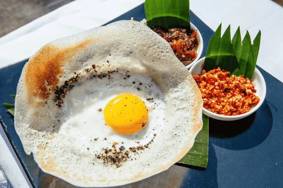 Hoppers in Sri Lanka — bowl-shaped rice pancakes served with coconut sambol and curry